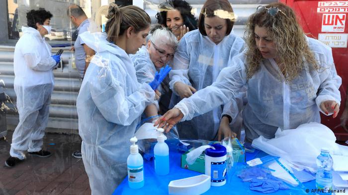 Volunteers in protective costumes in Israel